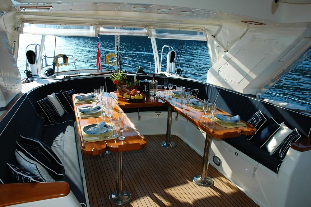 A table laid on the deck of a sailing yacht